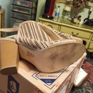 Several pairs of sandals boots and a pair of sneakers by Nike